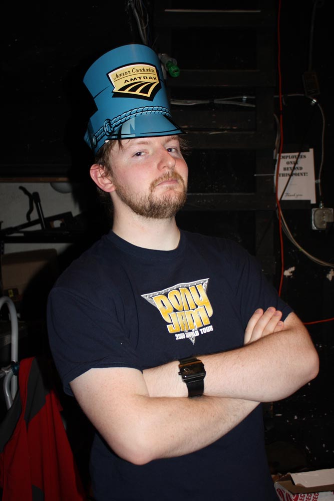 In Portland now, Graham models the Amtrak hat backstage