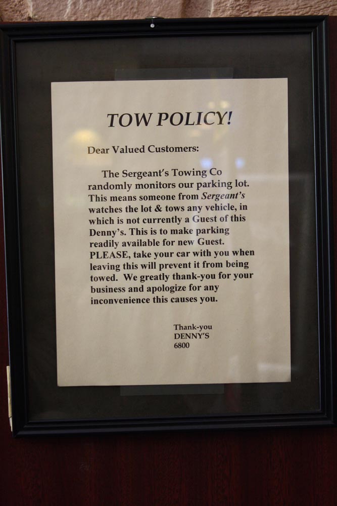 The horrifying "tow policy" sign in Denny's
