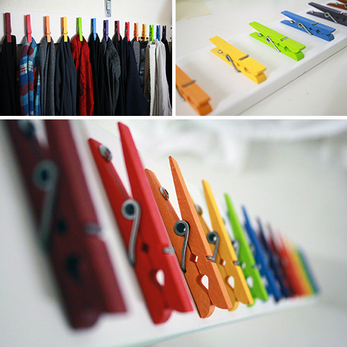 Clothes pins on a clothes line rope - four wooden pegs holding